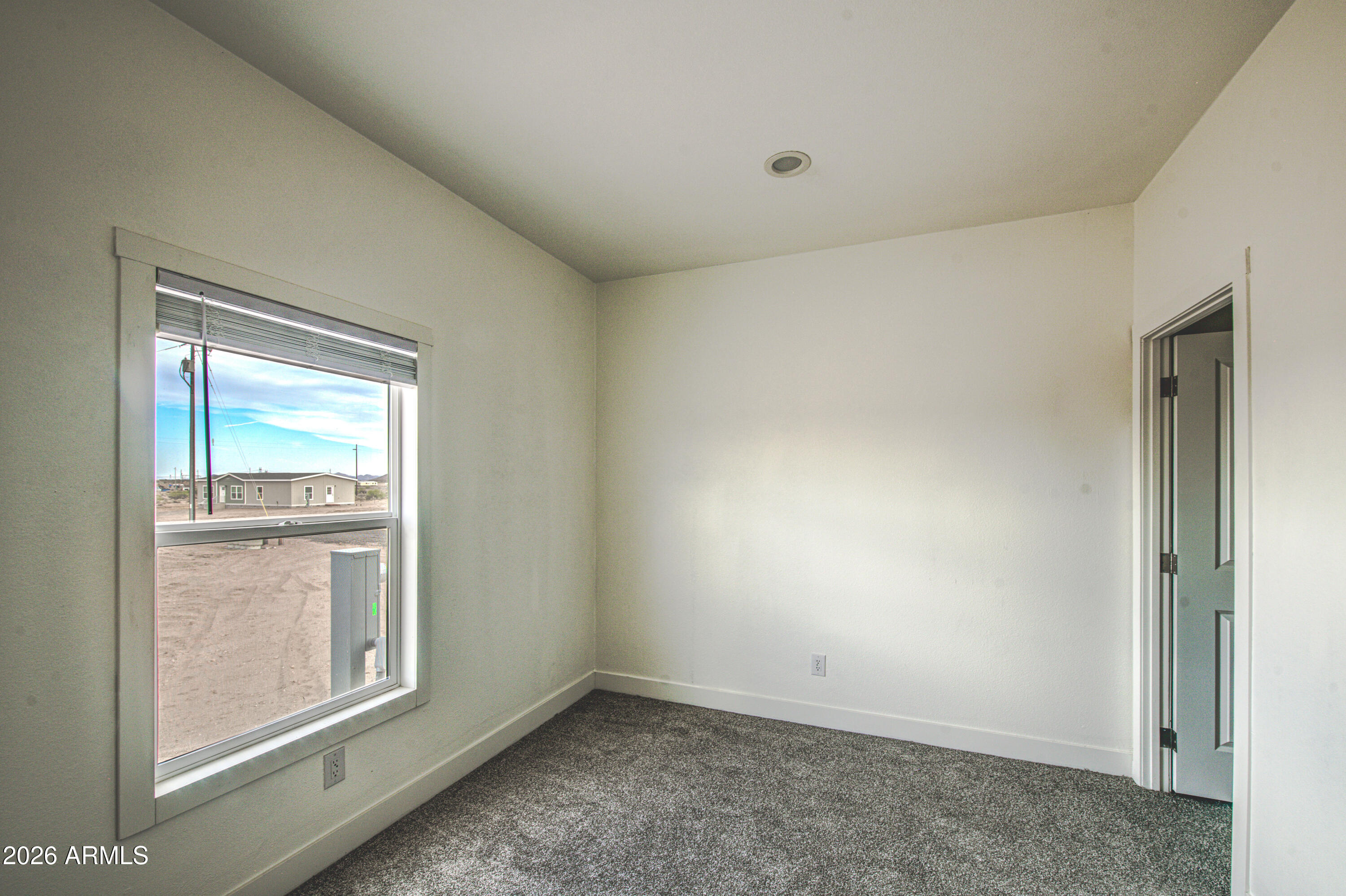 39120 West Maldonado Road Tonopah, AZ 85354 - Photo 4 of 37 an empty room with a window