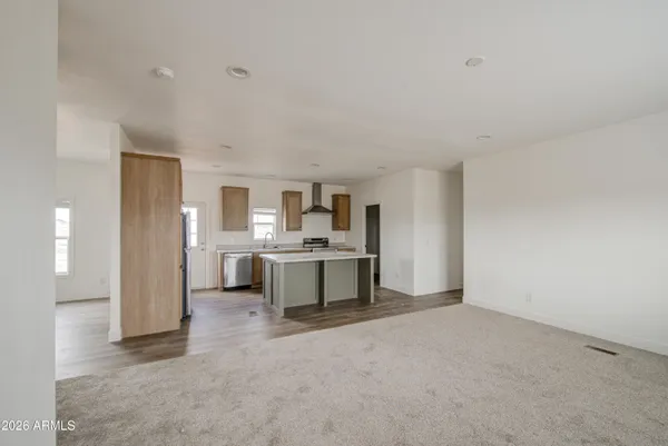 a view of a kitchen with a sink and white cabinets