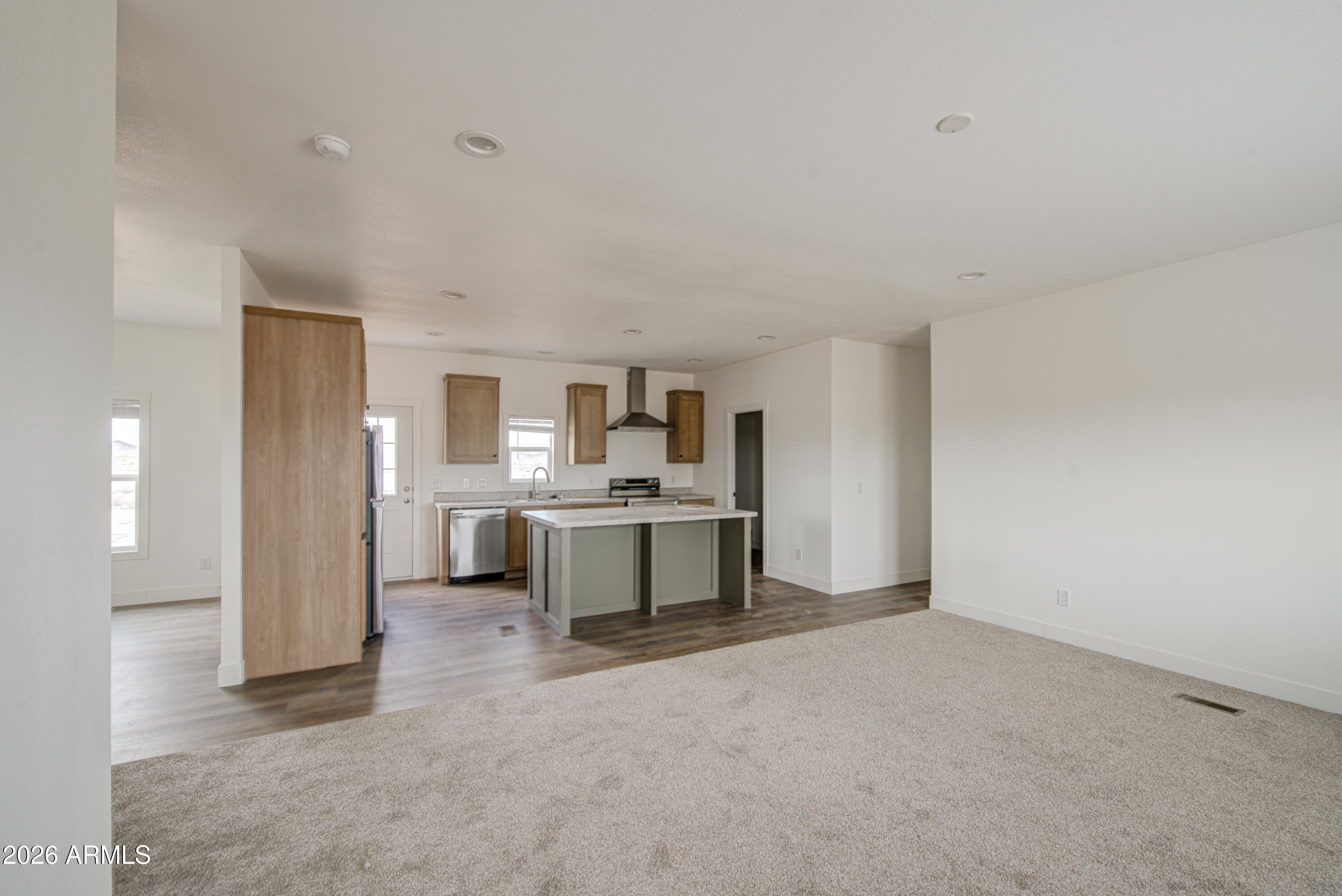 39120 West Maldonado Road Tonopah, AZ 85354 - Photo 6 of 37 a view of a kitchen with a sink and white cabinets