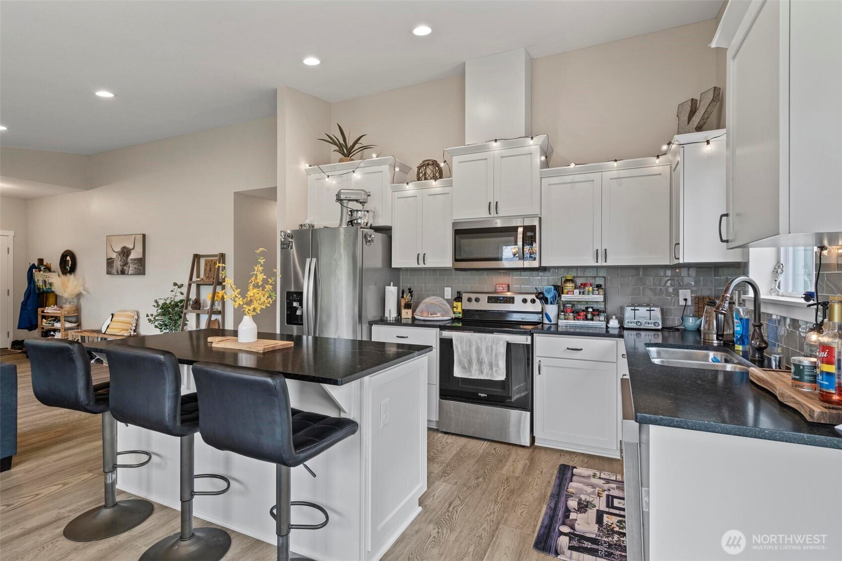 144-38 18 Loop Road Centralia, WA 98531 - Photo 11 of 39 a kitchen with stainless steel appliances kitchen island granite countertop a sink and cabinets