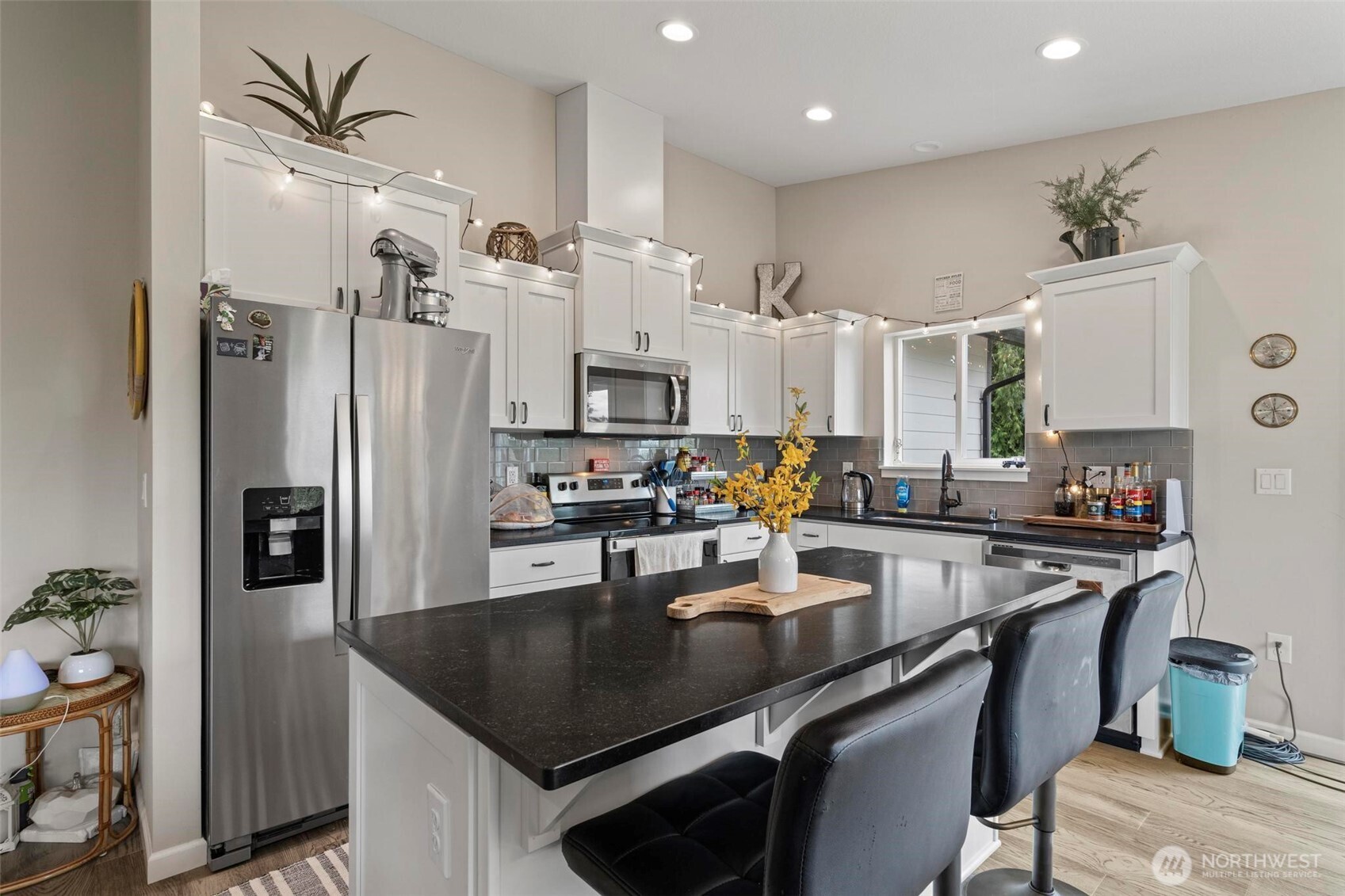 144-38 18 Loop Road Centralia, WA 98531 - Photo 12 of 39 a kitchen with stainless steel appliances granite countertop a sink a stove and a refrigerator
