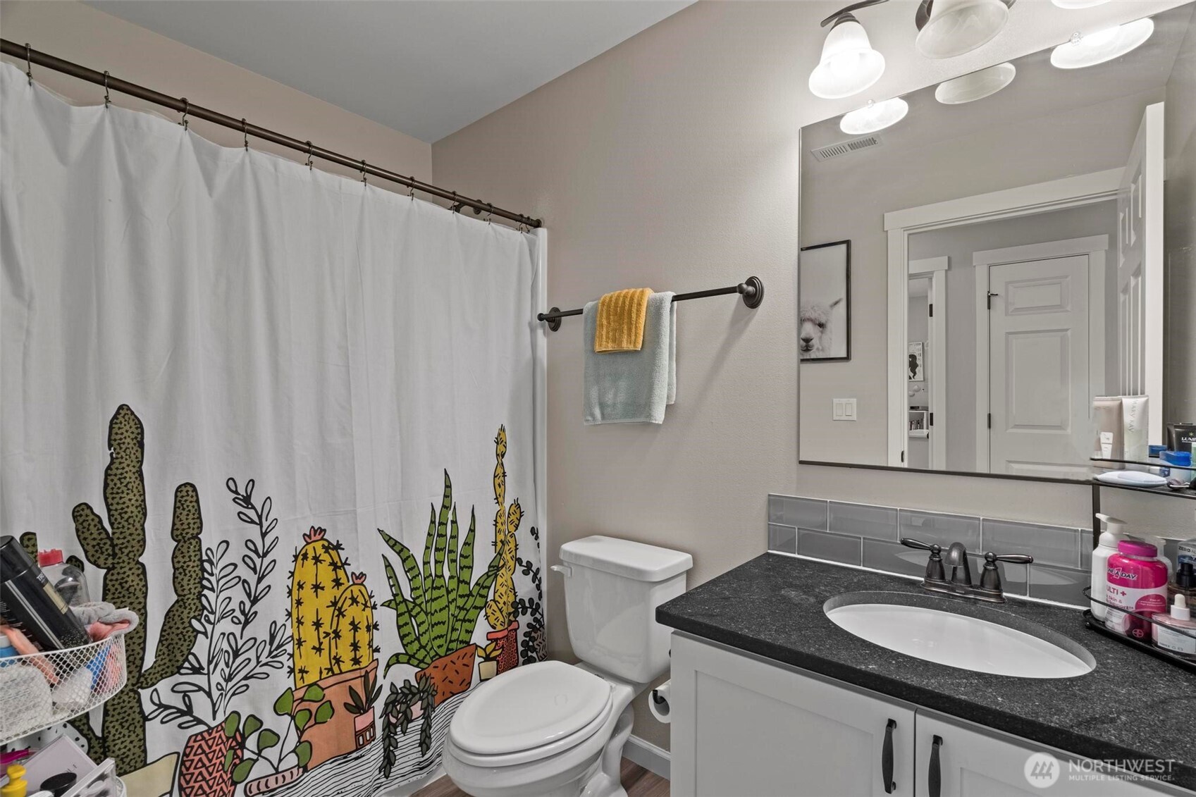 144-38 18 Loop Road Centralia, WA 98531 - Photo 17 of 39 a bathroom with a granite countertop sink vanity mirror and toilet