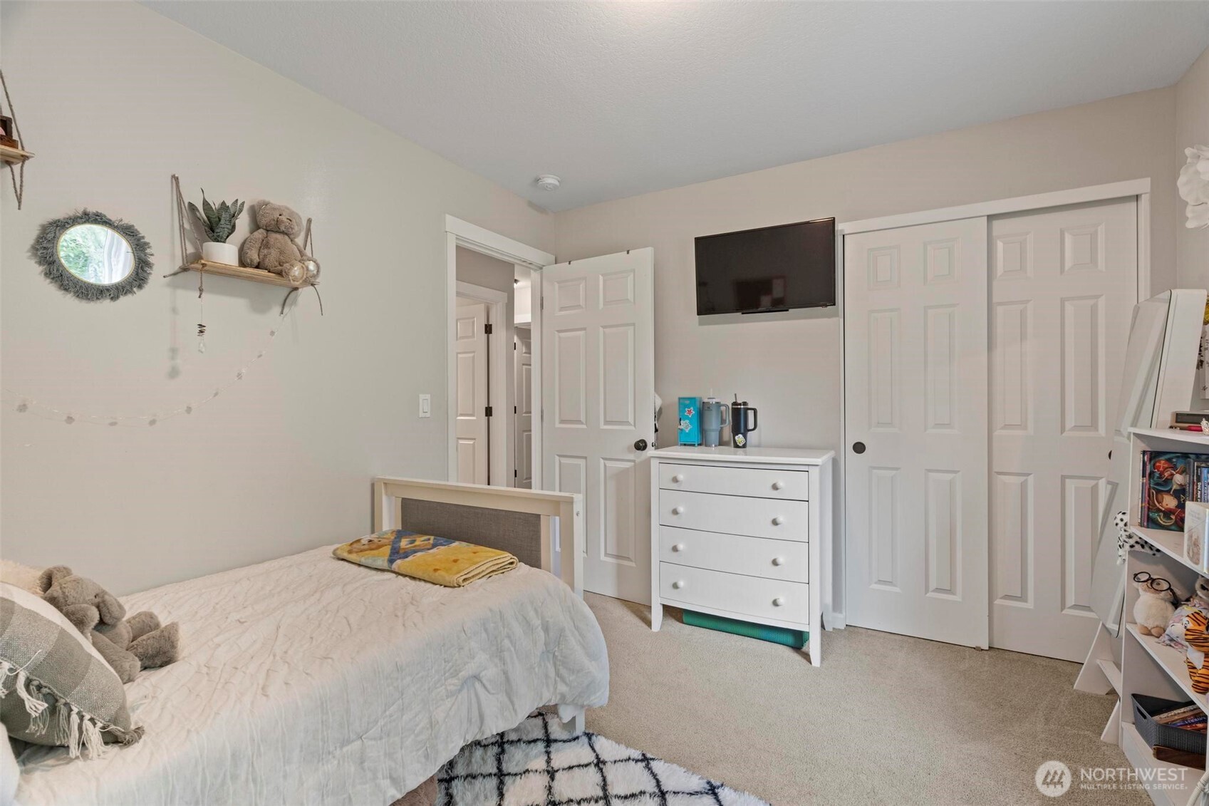 144-38 18 Loop Road Centralia, WA 98531 - Photo 20 of 39 a bedroom with a bed and a flat tv screen on dresser
