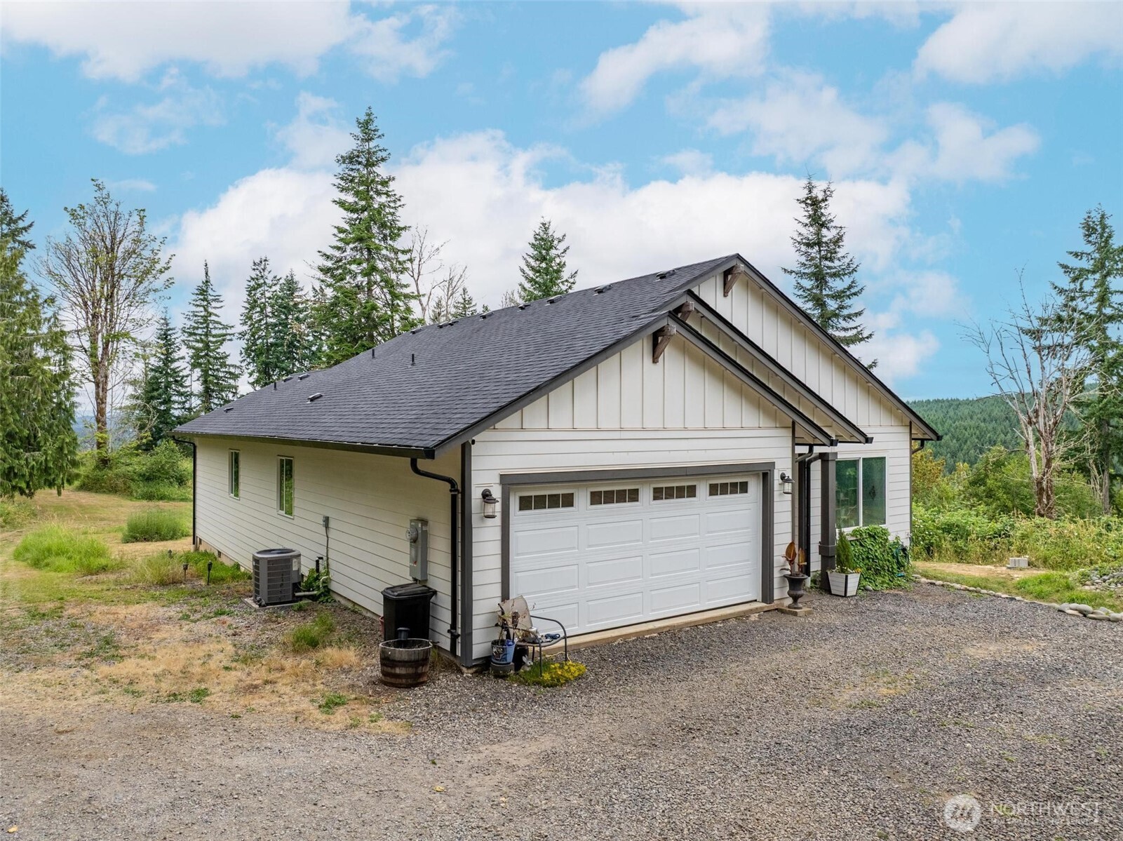 144-38 18 Loop Road Centralia, WA 98531 - Photo 27 of 39 a view of a house with a yard and garage