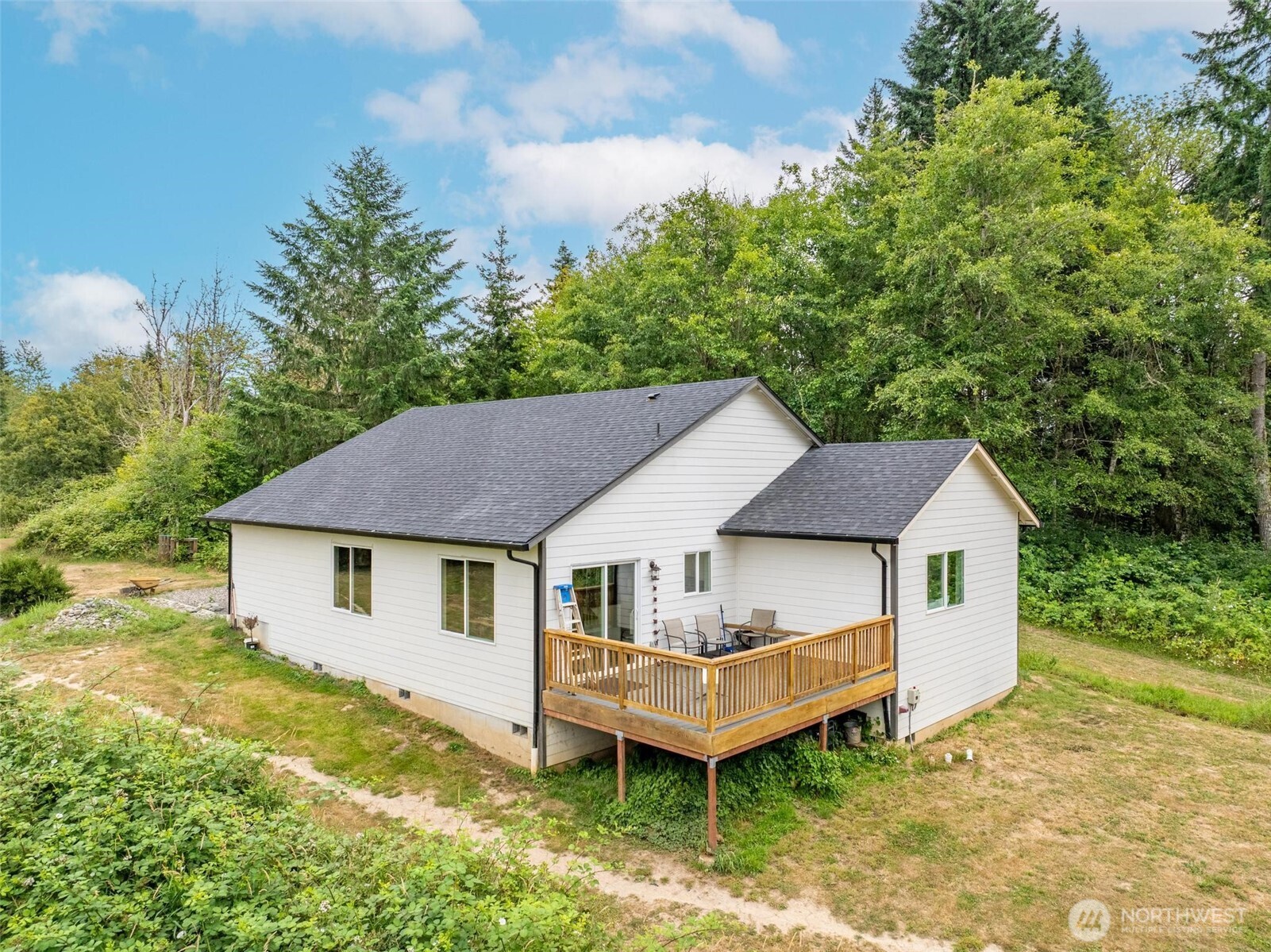 144-38 18 Loop Road Centralia, WA 98531 - Photo 33 of 39 a aerial view of a house with a yard and sitting area