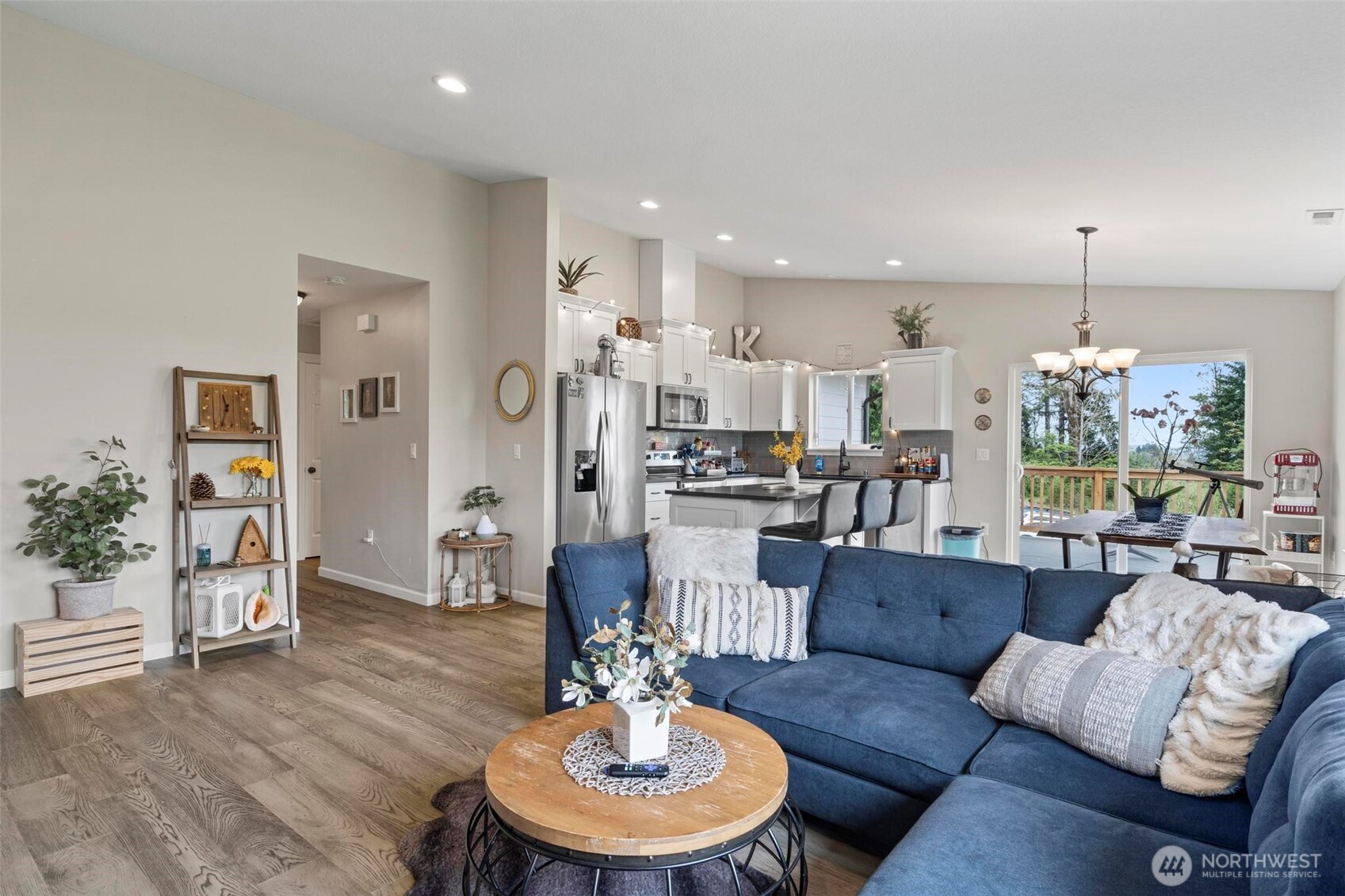 144-38 18 Loop Road Centralia, WA 98531 - Photo 4 of 39 a living room with furniture kitchen view and a chandelier