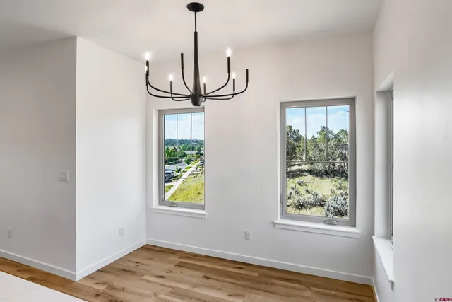 a bathroom with a shower and a glass door
