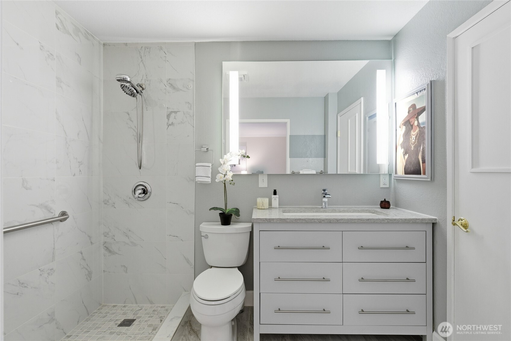 412 164th Place Southeast Bothell, WA 98012 - Photo 18 of 39 a bathroom with a sink toilet a shower and a mirror