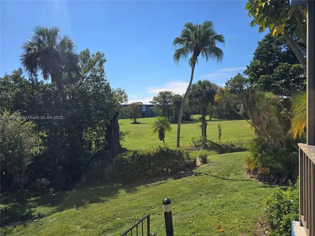 a view of lake with green space