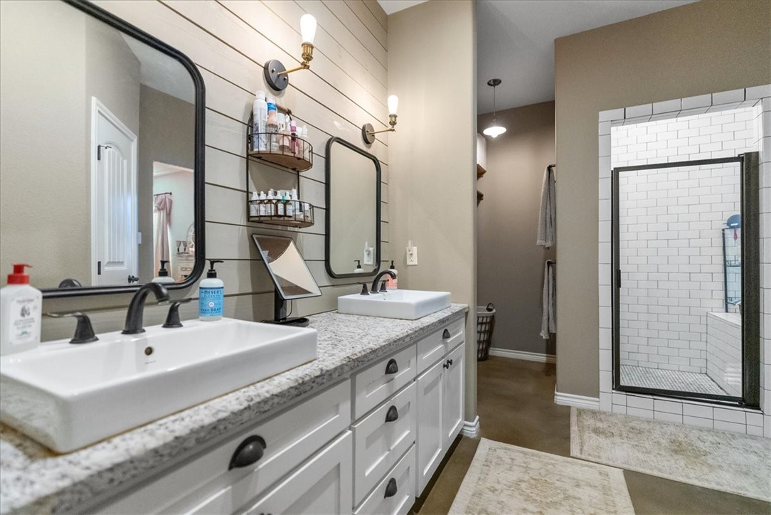 226 Private Road Alice, TX 78332 - Photo 17 of 40 a bathroom with double vanity and a mirror