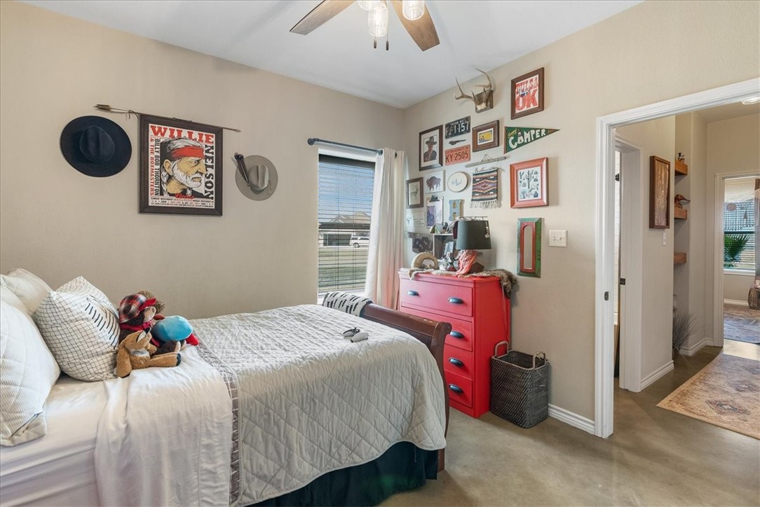 226 Private Road Alice, TX 78332 - Photo 23 of 40 a bedroom with a bed and a chandelier