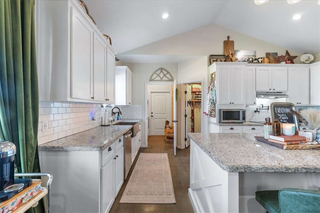 226 Private Road Alice, TX 78332 - Photo 6 of 40 a kitchen with stainless steel appliances granite countertop a sink stove and refrigerator