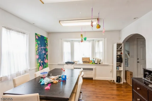a living room with kitchen island furniture and a window