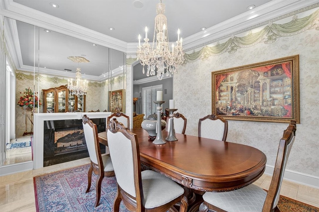 4811 Ocean Drive Corpus Christi, TX 78412 - Photo 13 of 39 a dining room with furniture a chandelier and window