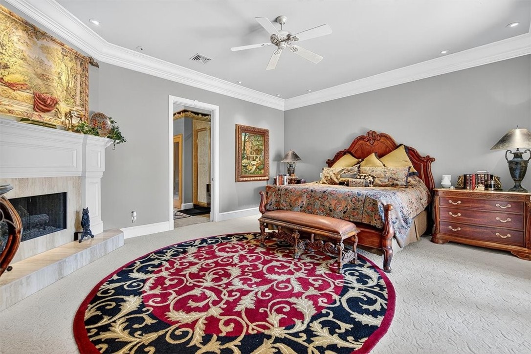 4811 Ocean Drive Corpus Christi, TX 78412 - Photo 16 of 39 a bedroom with a bed and a fireplace