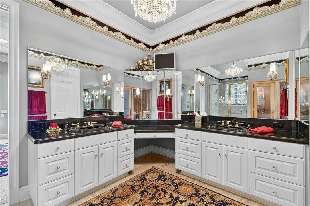 4811 Ocean Drive Corpus Christi, TX 78412 - Photo 17 of 39 a kitchen with granite countertop white cabinets and white appliances
