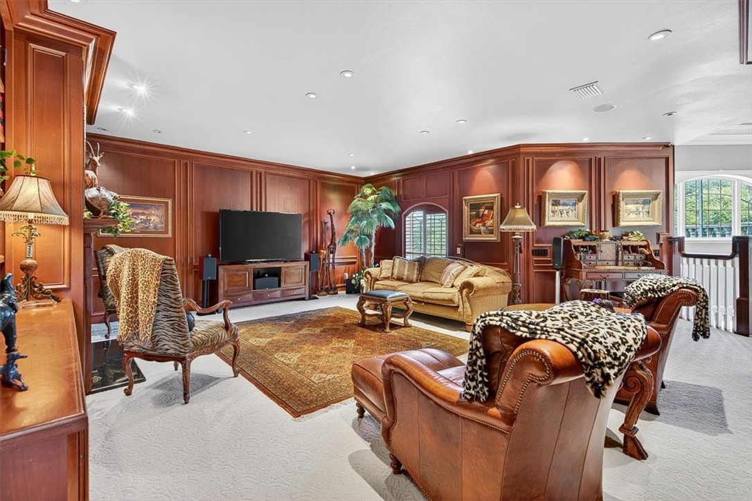 4811 Ocean Drive Corpus Christi, TX 78412 - Photo 21 of 39 a living room with furniture a large window and a flat screen tv