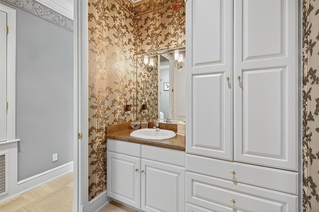 4811 Ocean Drive Corpus Christi, TX 78412 - Photo 29 of 39 a bathroom with a sink and a mirror