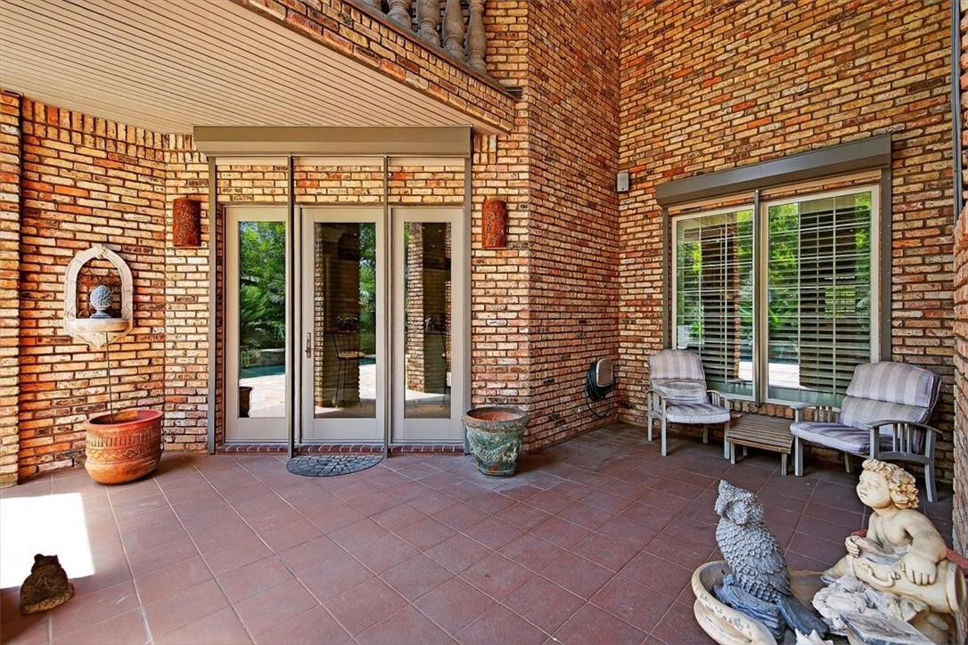 4811 Ocean Drive Corpus Christi, TX 78412 - Photo 32 of 39 a backyard of a house with seating space