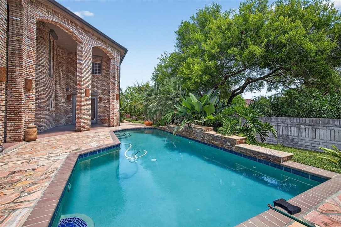 4811 Ocean Drive Corpus Christi, TX 78412 - Photo 34 of 39 a view of a backyard with a large tree