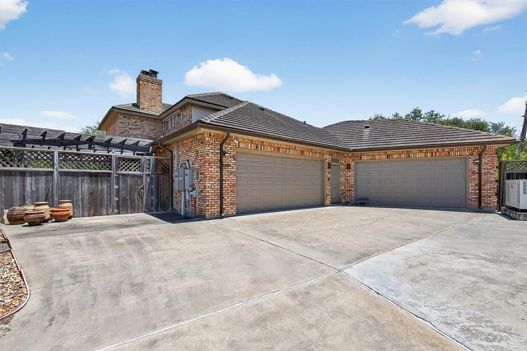 4811 Ocean Drive Corpus Christi, TX 78412 - Photo 35 of 39 a front view of a house with a garage