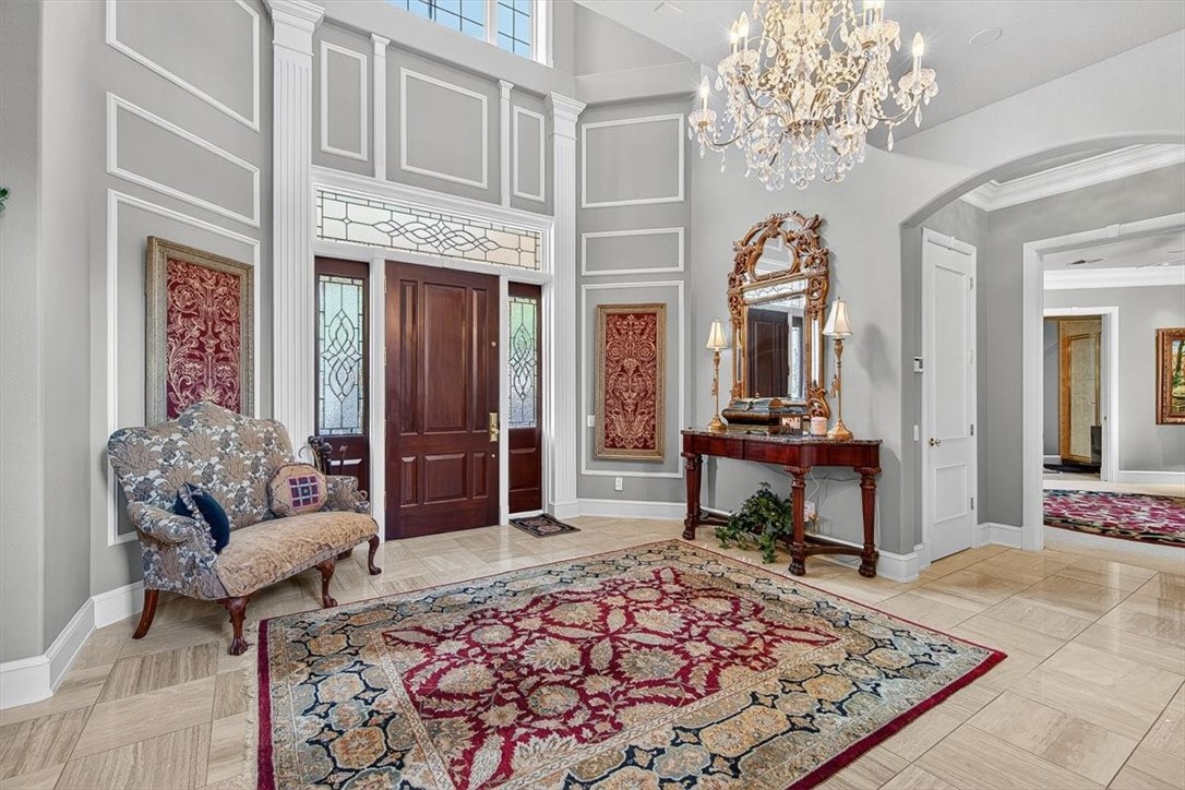4811 Ocean Drive Corpus Christi, TX 78412 - Photo 5 of 39 a living room with furniture and a chandelier