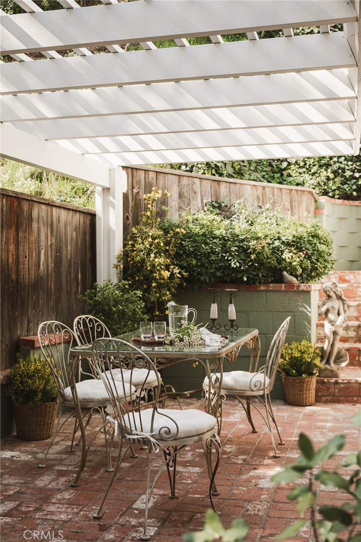 601 Sinclair Avenue Glendale, CA 91206 - Photo 16 of 38 a roof deck with table and chairs and potted plants