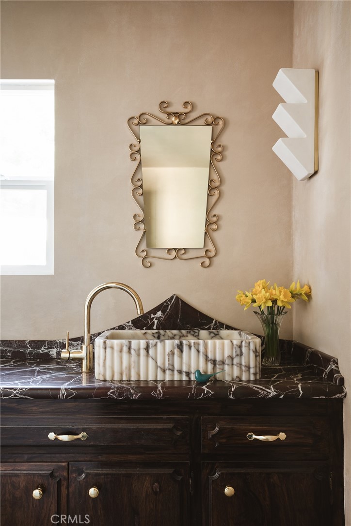601 Sinclair Avenue Glendale, CA 91206 - Photo 33 of 38 a bathroom with a sink and a mirror