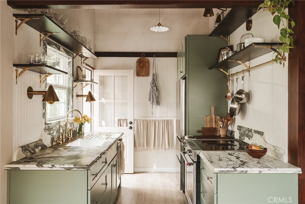 601 Sinclair Avenue Glendale, CA 91206 - Photo 9 of 38 a kitchen with a stove a sink and a refrigerator