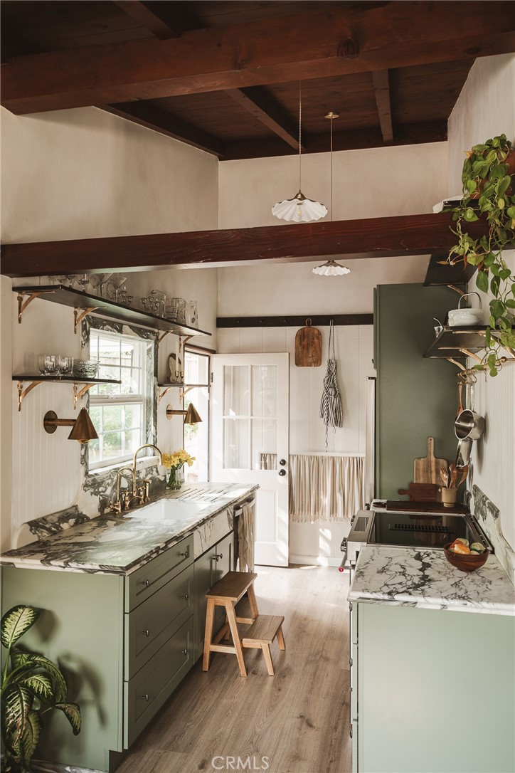 601 Sinclair Avenue Glendale, CA 91206 - Photo 10 of 38 a kitchen with a sink a stove and chairs