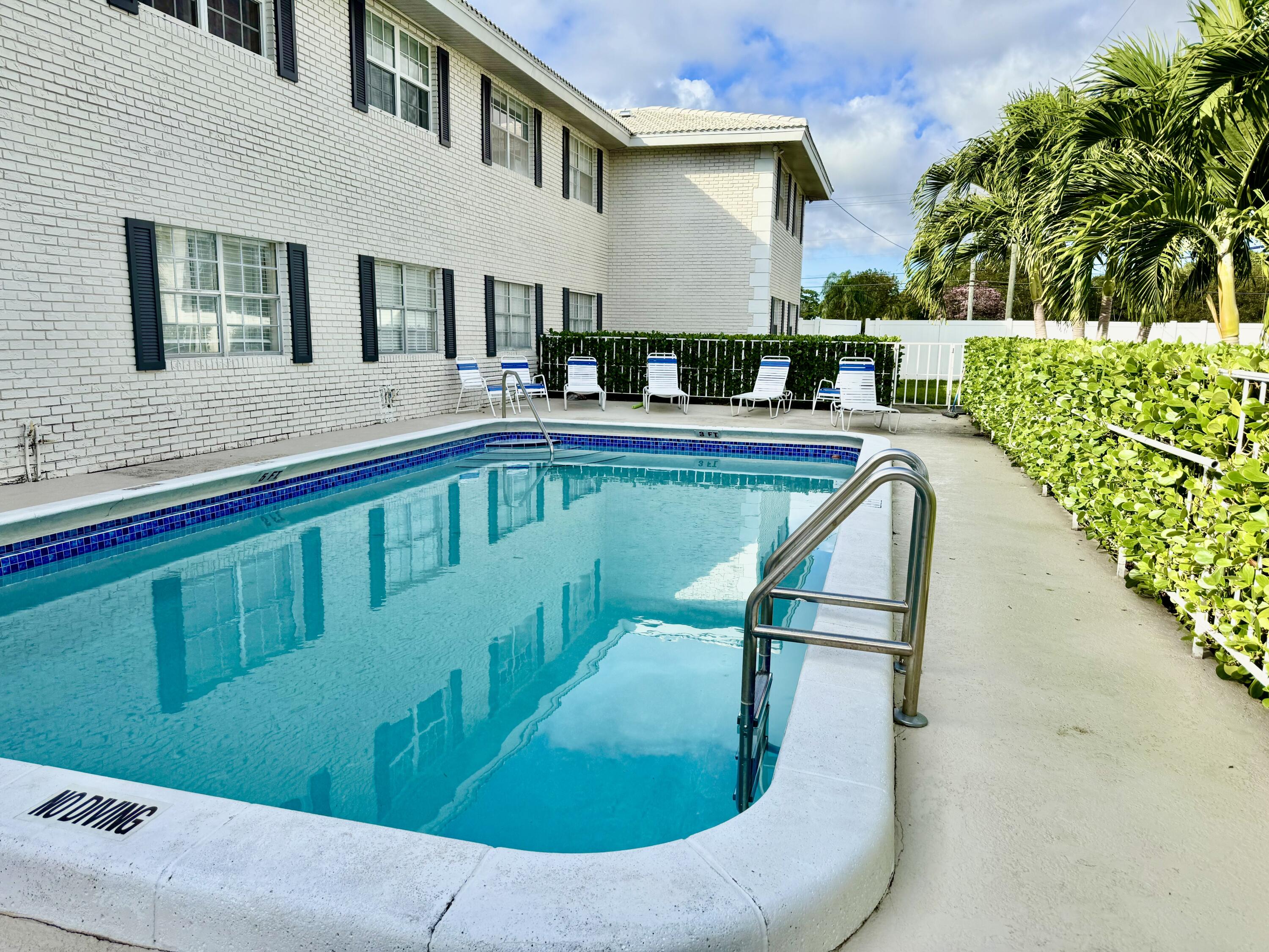 299 Southwest 7th Street, Unit 1040 Boca Raton, FL 33432 - Photo 18 of 31 Building Pool Area