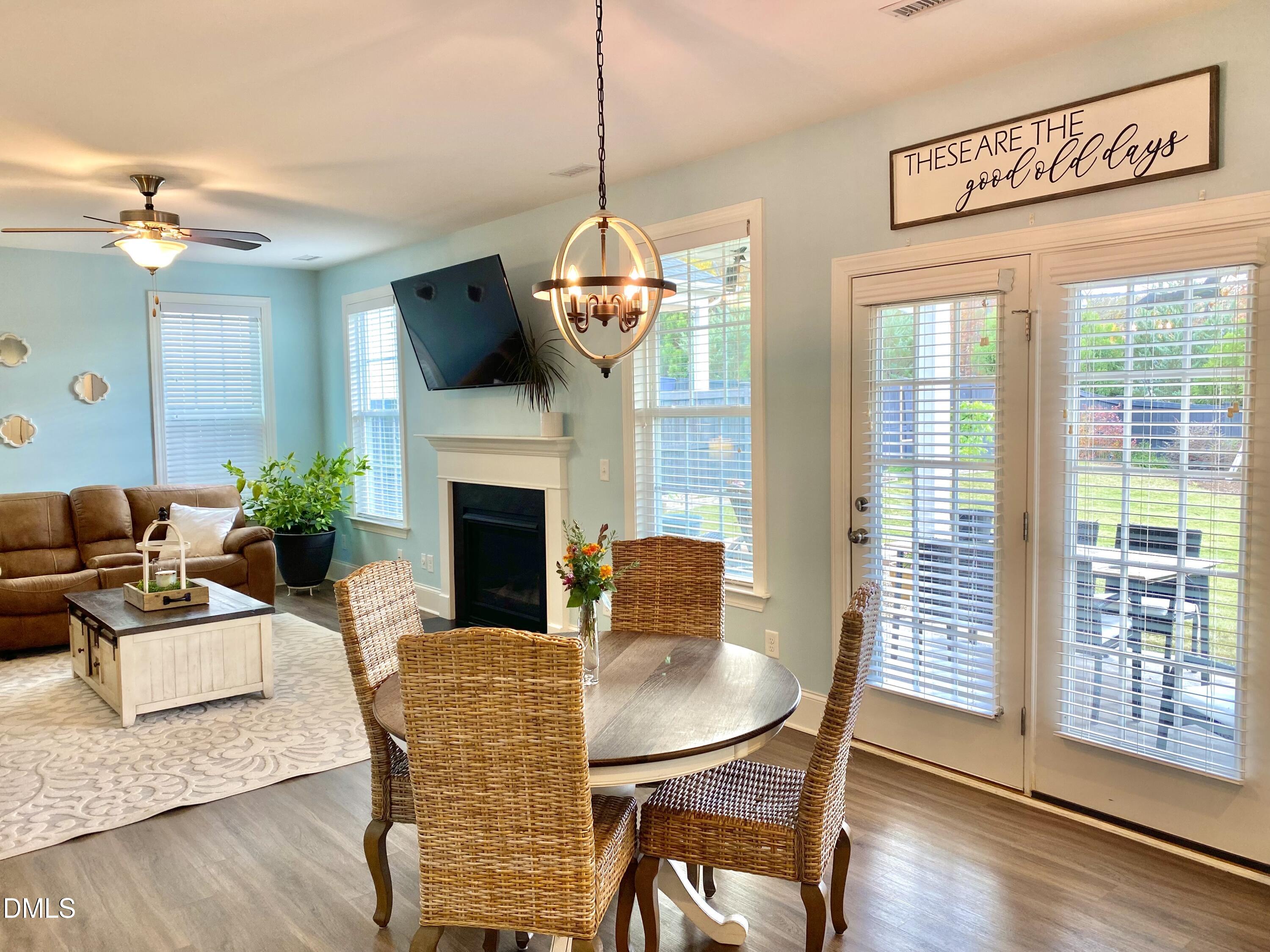 2913 Thurman Dairy Loop Wake Forest, NC 27587 - Photo 13 of 31 a dining room with furniture a chandelier and wooden floor