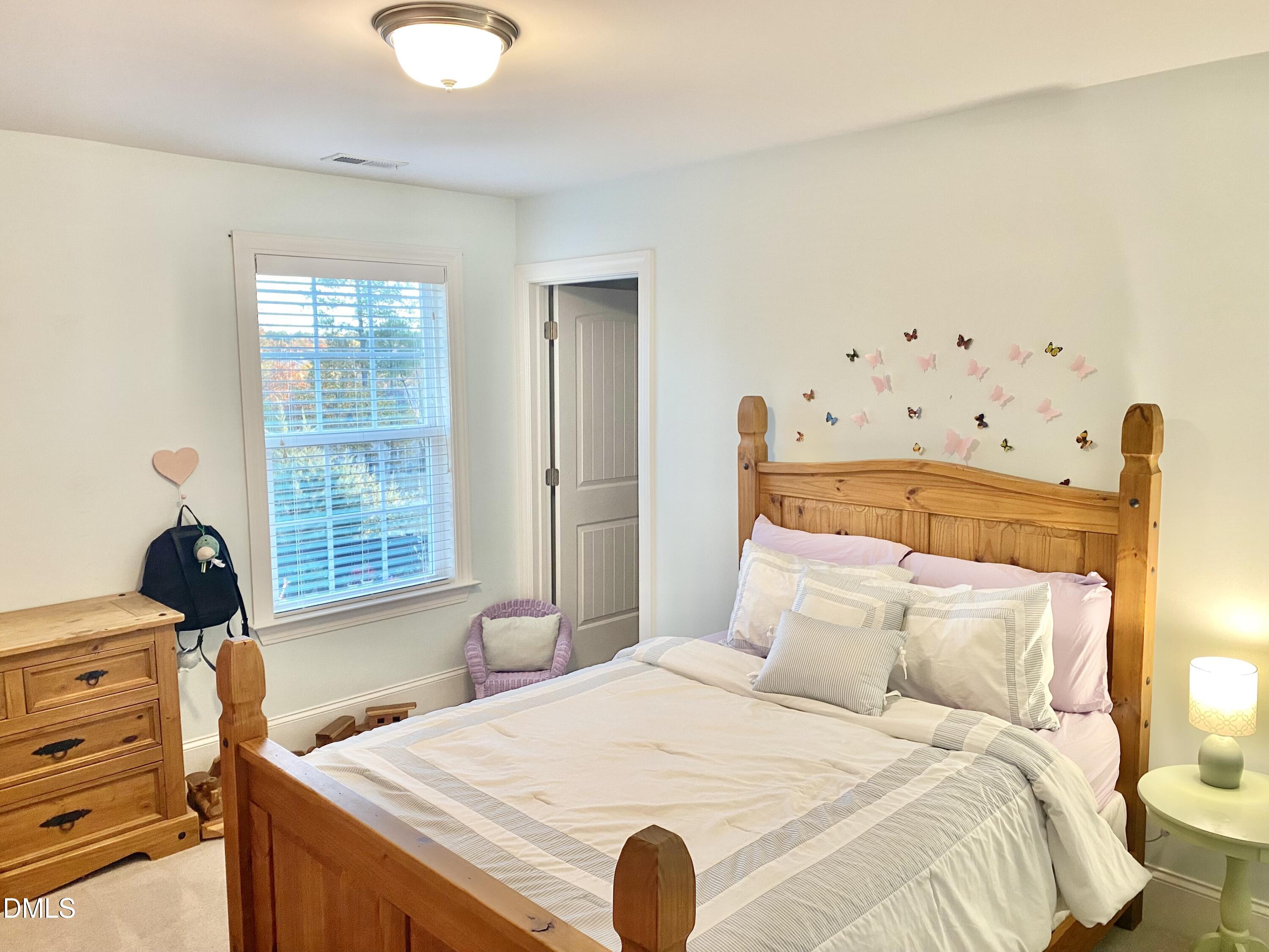 2913 Thurman Dairy Loop Wake Forest, NC 27587 - Photo 18 of 31 a bedroom with a bed and a window