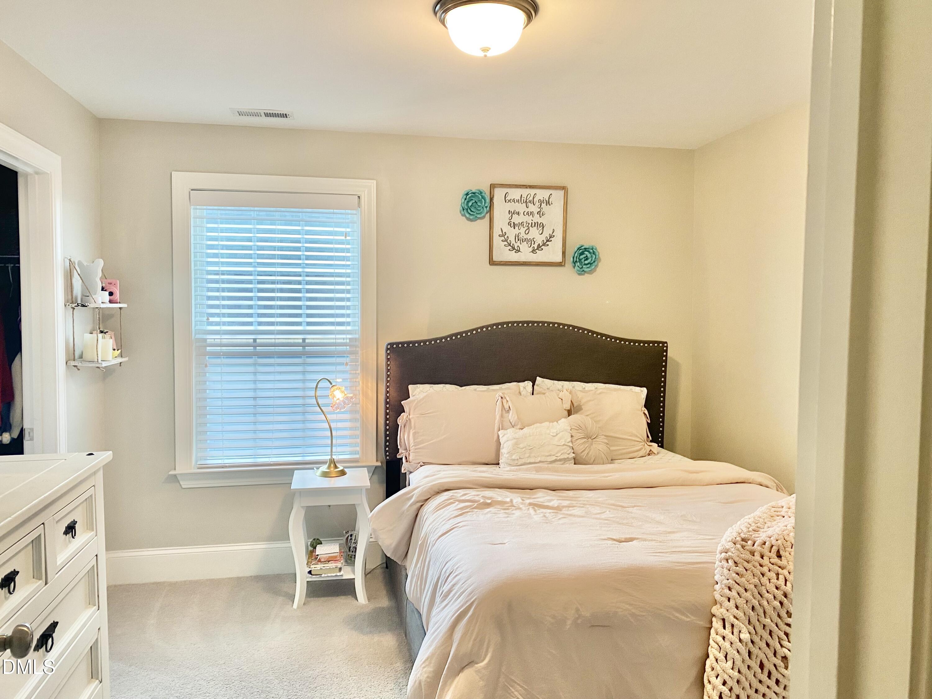2913 Thurman Dairy Loop Wake Forest, NC 27587 - Photo 19 of 31 a bedroom with a bed and a window
