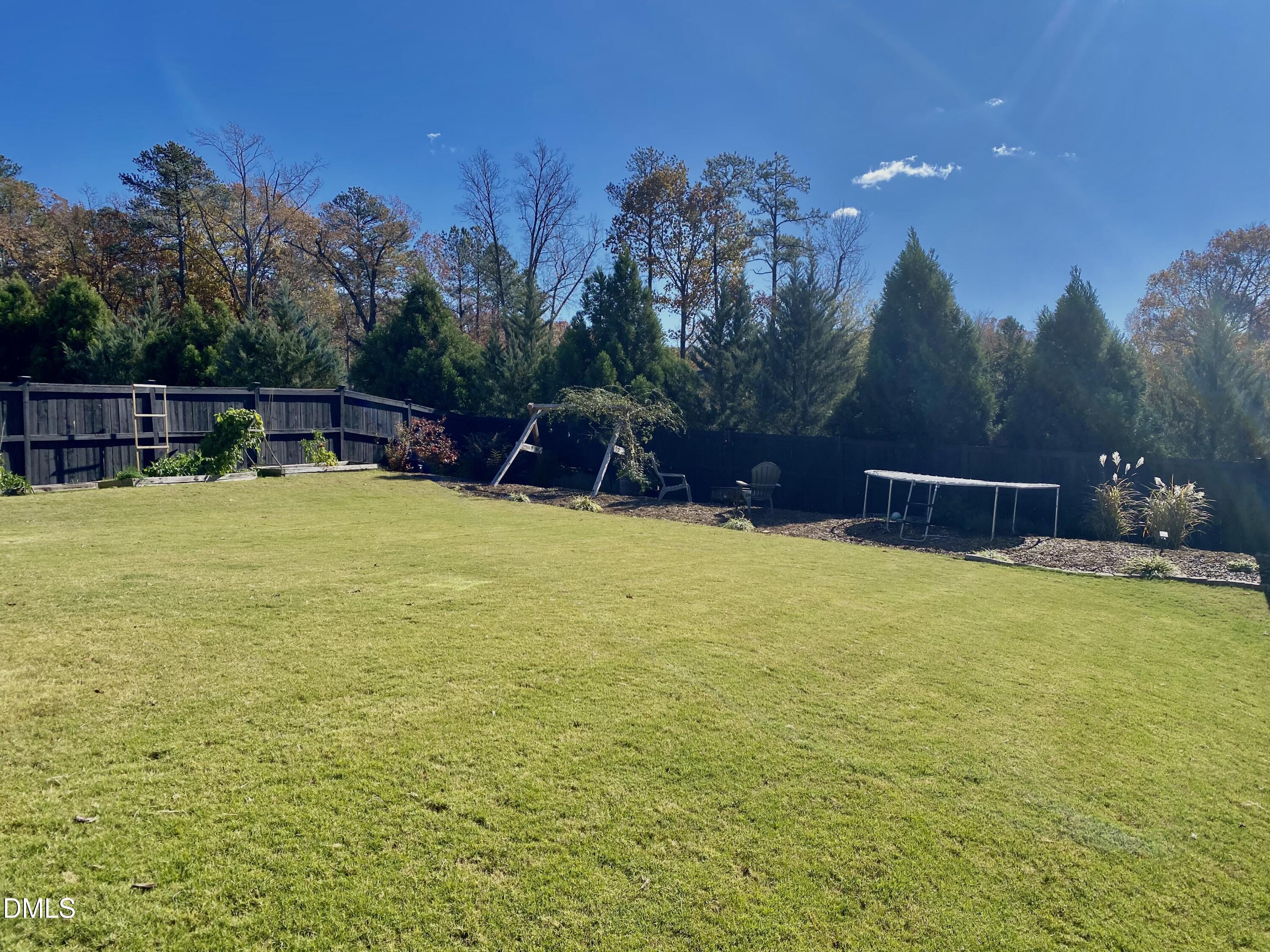 2913 Thurman Dairy Loop Wake Forest, NC 27587 - Photo 25 of 31 a view of a swimming pool with an outdoor space and seating area