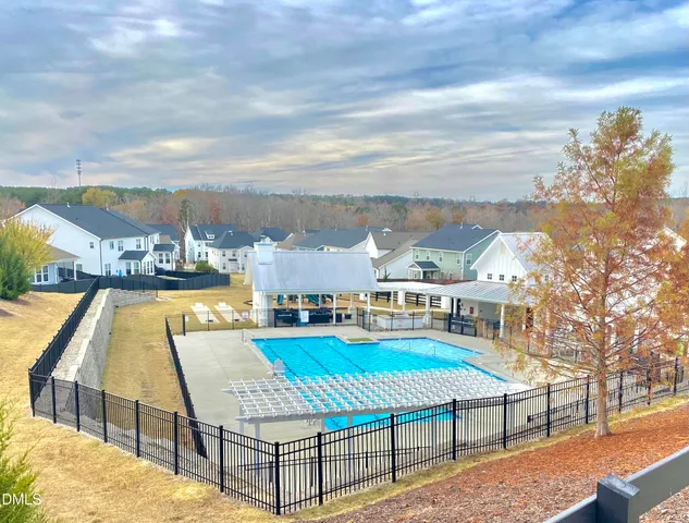 a view of a swimming pool with an outdoor space and seating area