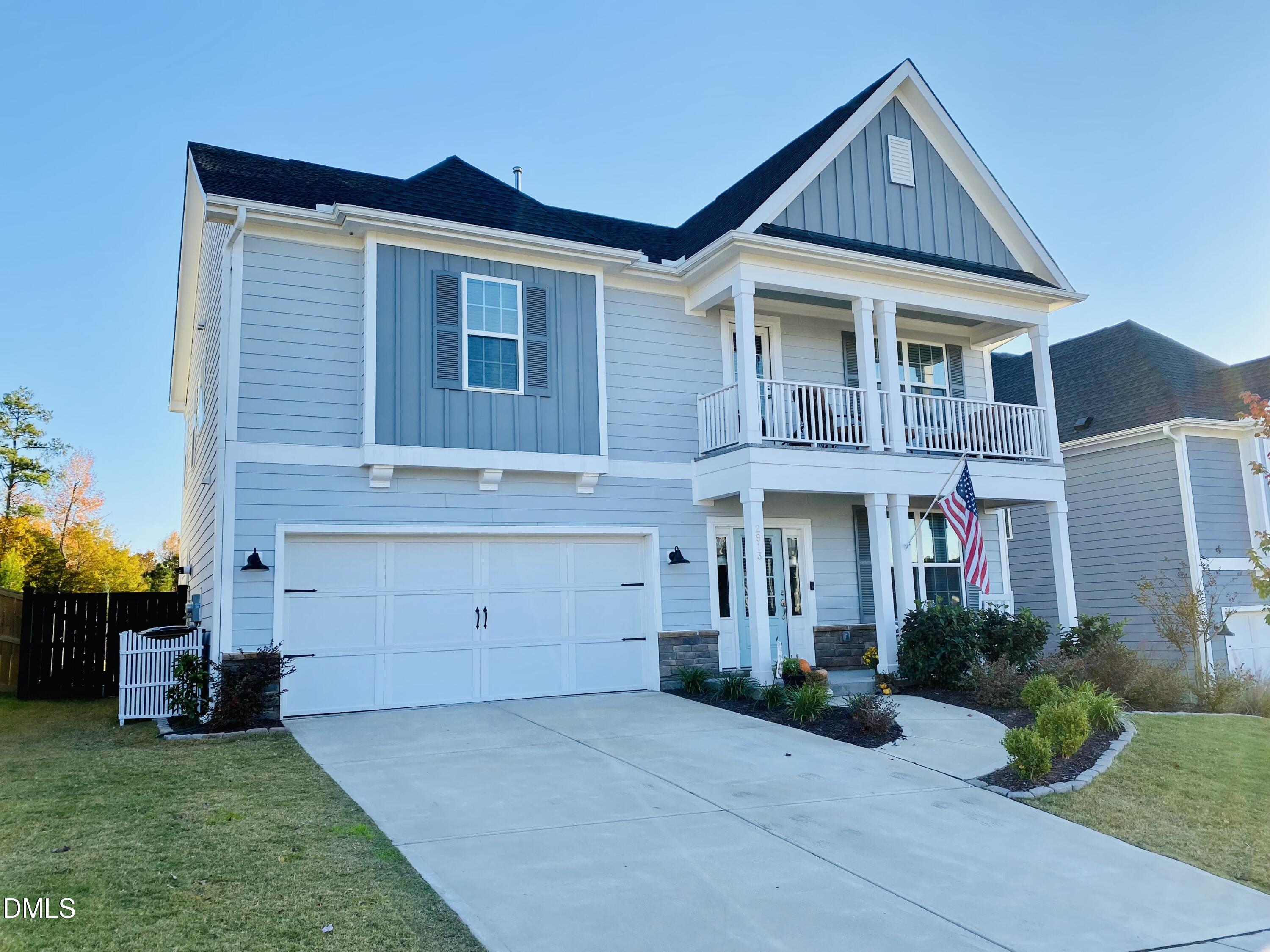 2913 Thurman Dairy Loop Wake Forest, NC 27587 - Photo 2 of 31 a front view of a house with a yard and garage