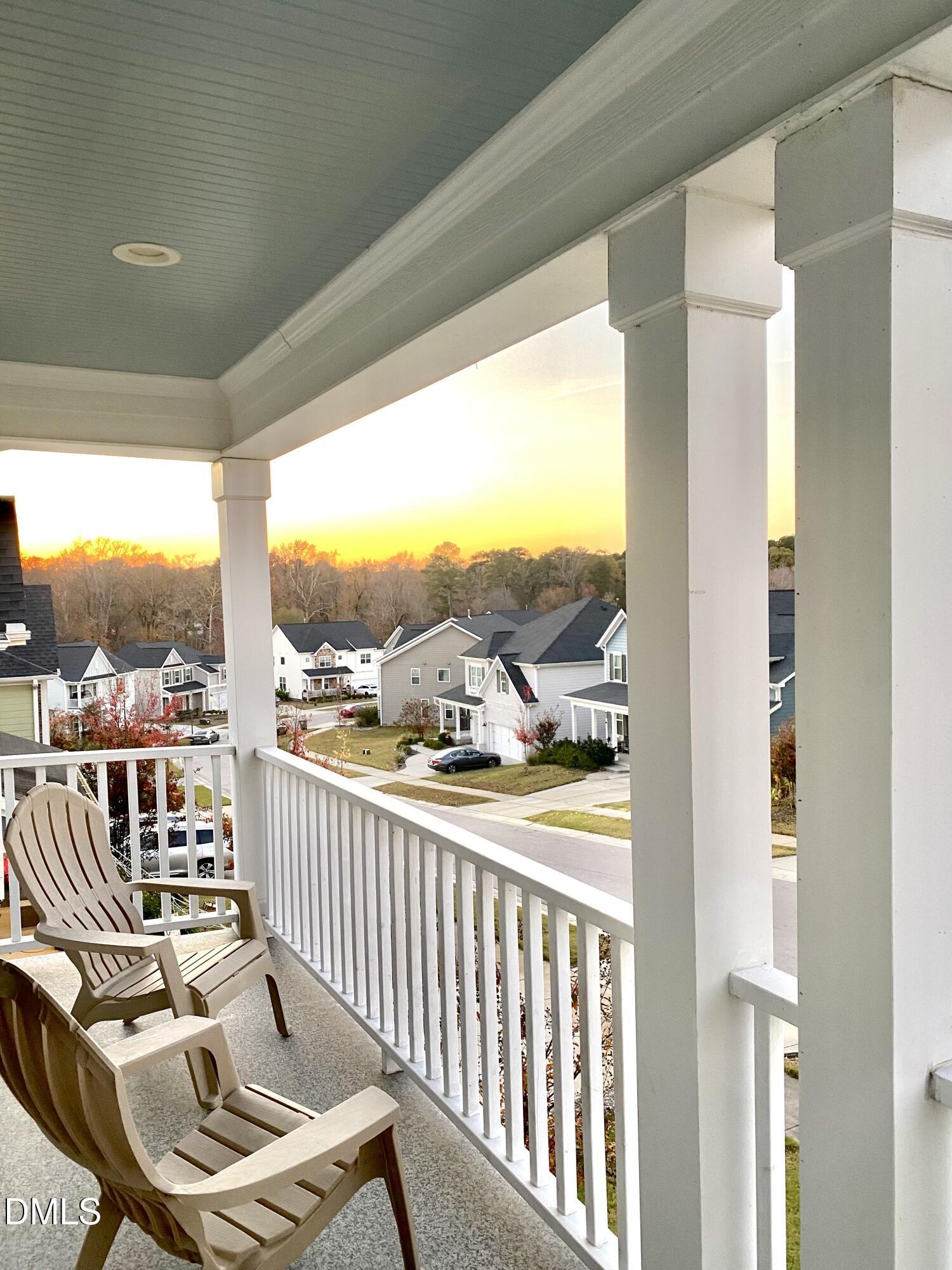 2913 Thurman Dairy Loop Wake Forest, NC 27587 - Photo 4 of 31 a view of a balcony with chair and floor to ceiling window