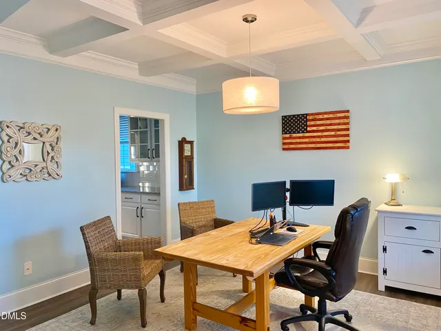 a room that has a window and a table in it