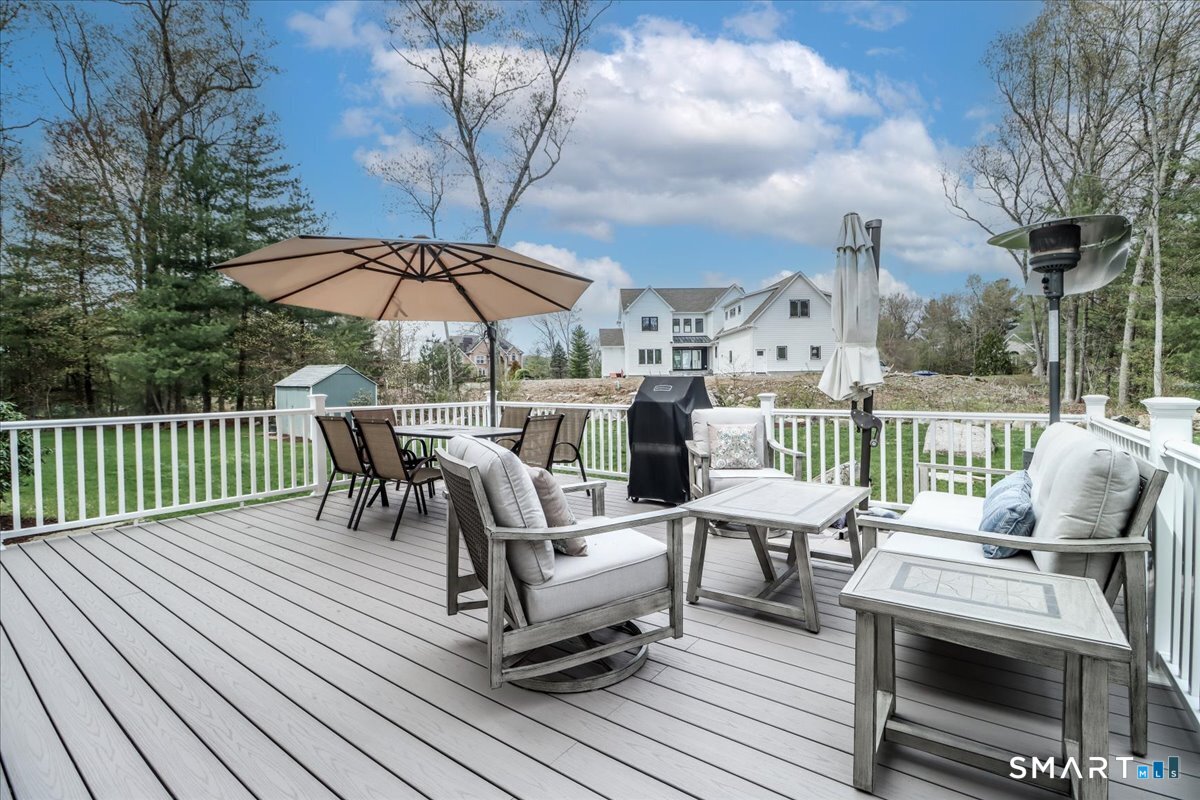 21 Pearl Street Newtown, CT 06482 - Photo 19 of 39 a view of a chairs and table on the wooden deck