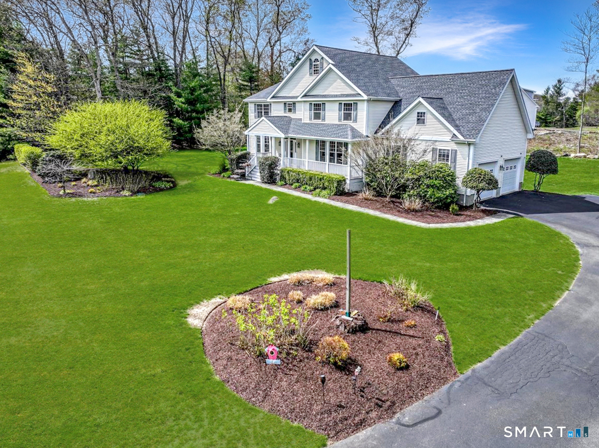 21 Pearl Street Newtown, CT 06482 - Photo 2 of 39 a view of a house with a yard and potted plants