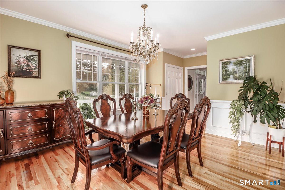 21 Pearl Street Newtown, CT 06482 - Photo 21 of 39 a view of a dining room with furniture window and wooden floor