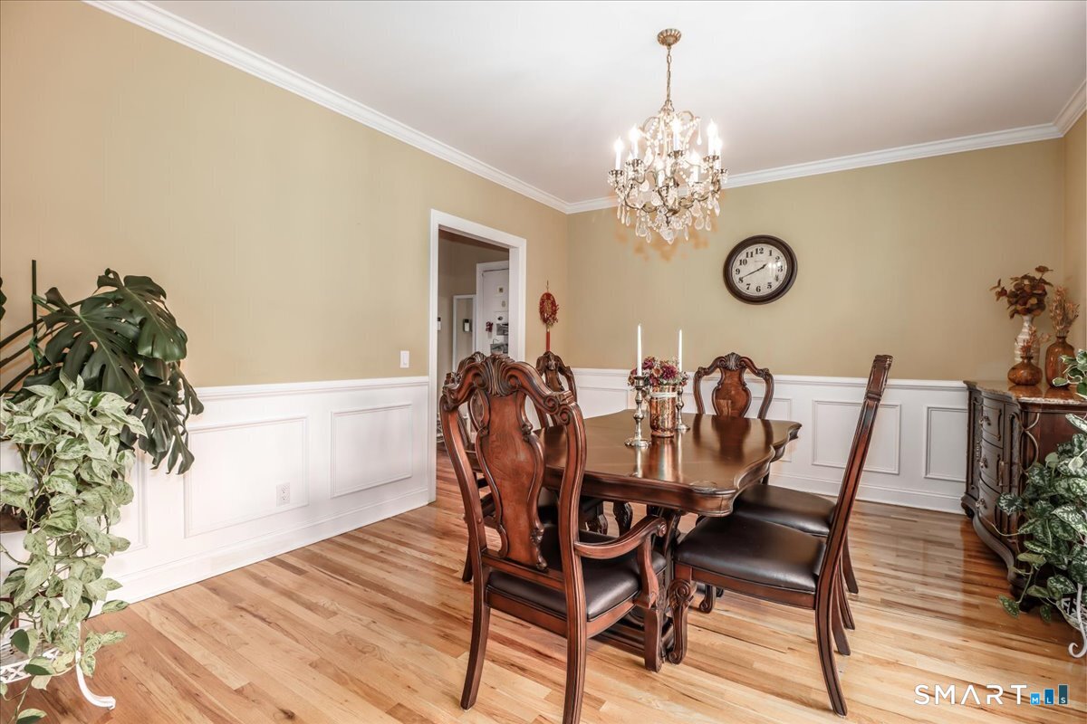 21 Pearl Street Newtown, CT 06482 - Photo 22 of 39 a view of a dining room with furniture and wooden floor