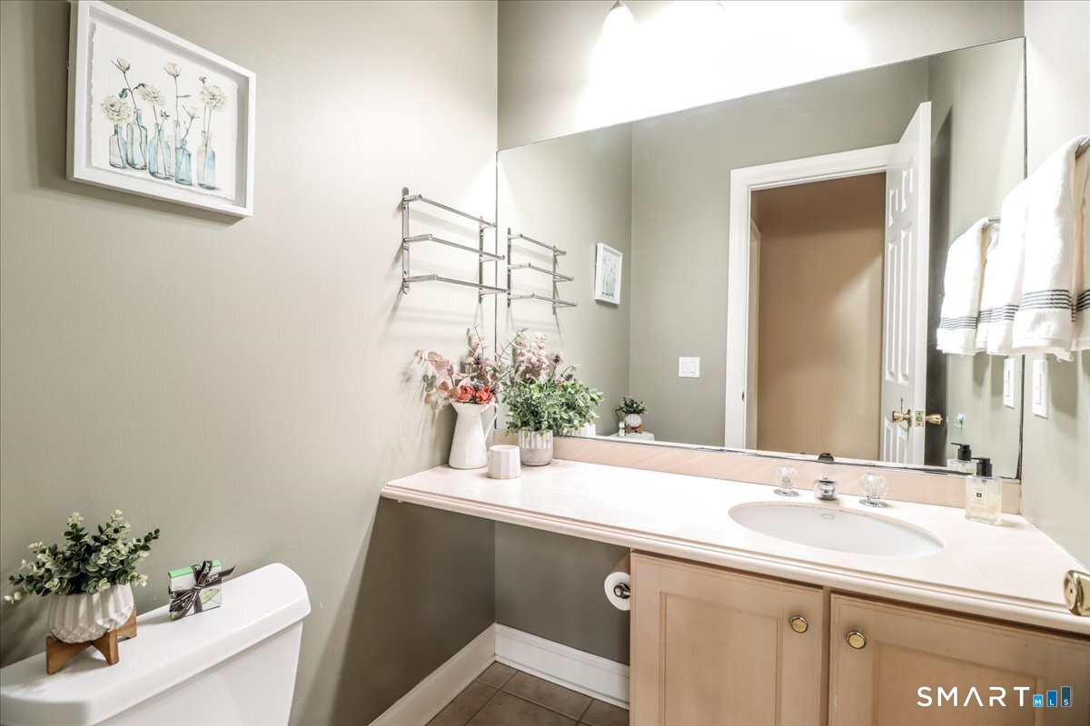 21 Pearl Street Newtown, CT 06482 - Photo 23 of 39 a bathroom with a sink and a mirror