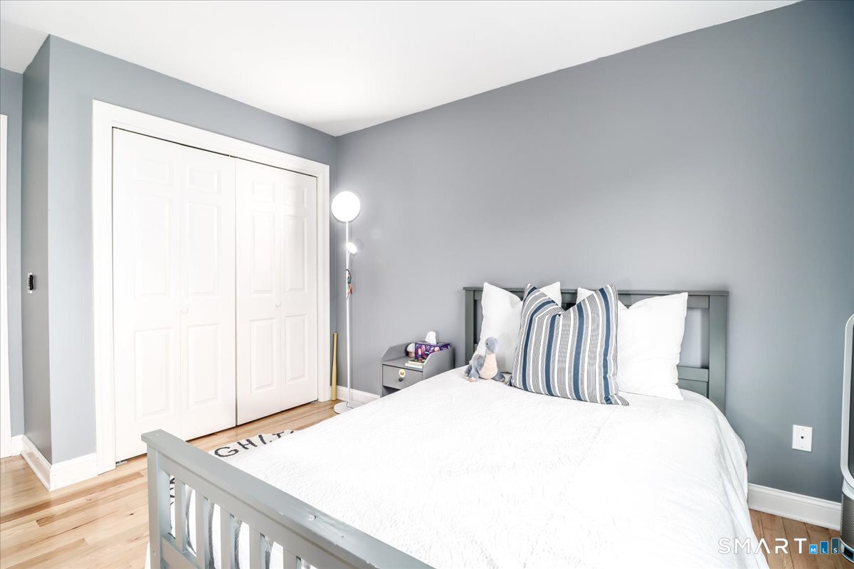 21 Pearl Street Newtown, CT 06482 - Photo 26 of 39 a bedroom with a bed and a window