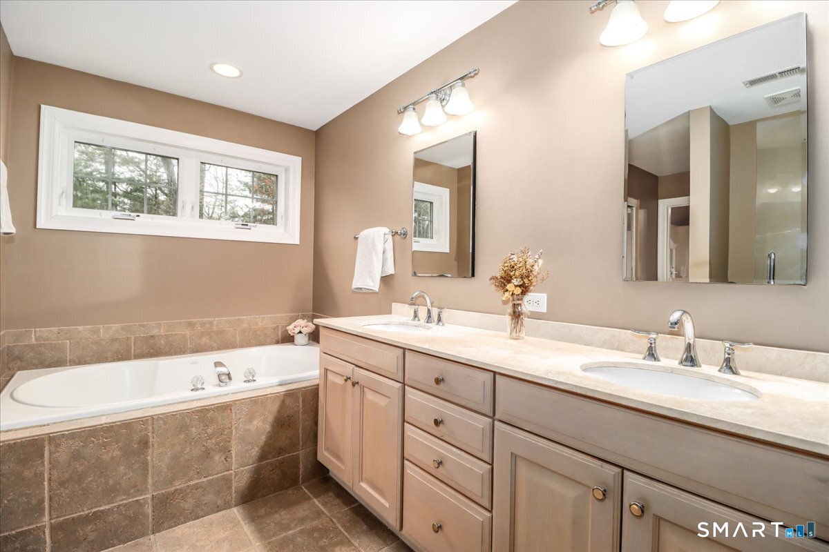 21 Pearl Street Newtown, CT 06482 - Photo 38 of 39 a bathroom with a granite countertop sink mirror bathtub and toilet