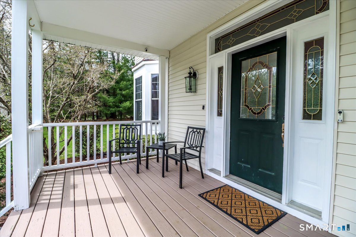 21 Pearl Street Newtown, CT 06482 - Photo 5 of 39 a view of balcony with furniture and wooden floor