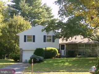 1215 Meinel Road Huntingdon Valley, PA 19006 - Photo 1 of 6 a front view of a house with a yard and garage