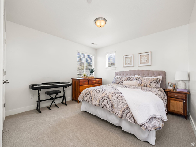 117 Ridge View Drive Elk Ridge, UT 84651 - Photo 26 of 42 Bedroom featuring light carpet and baseboards