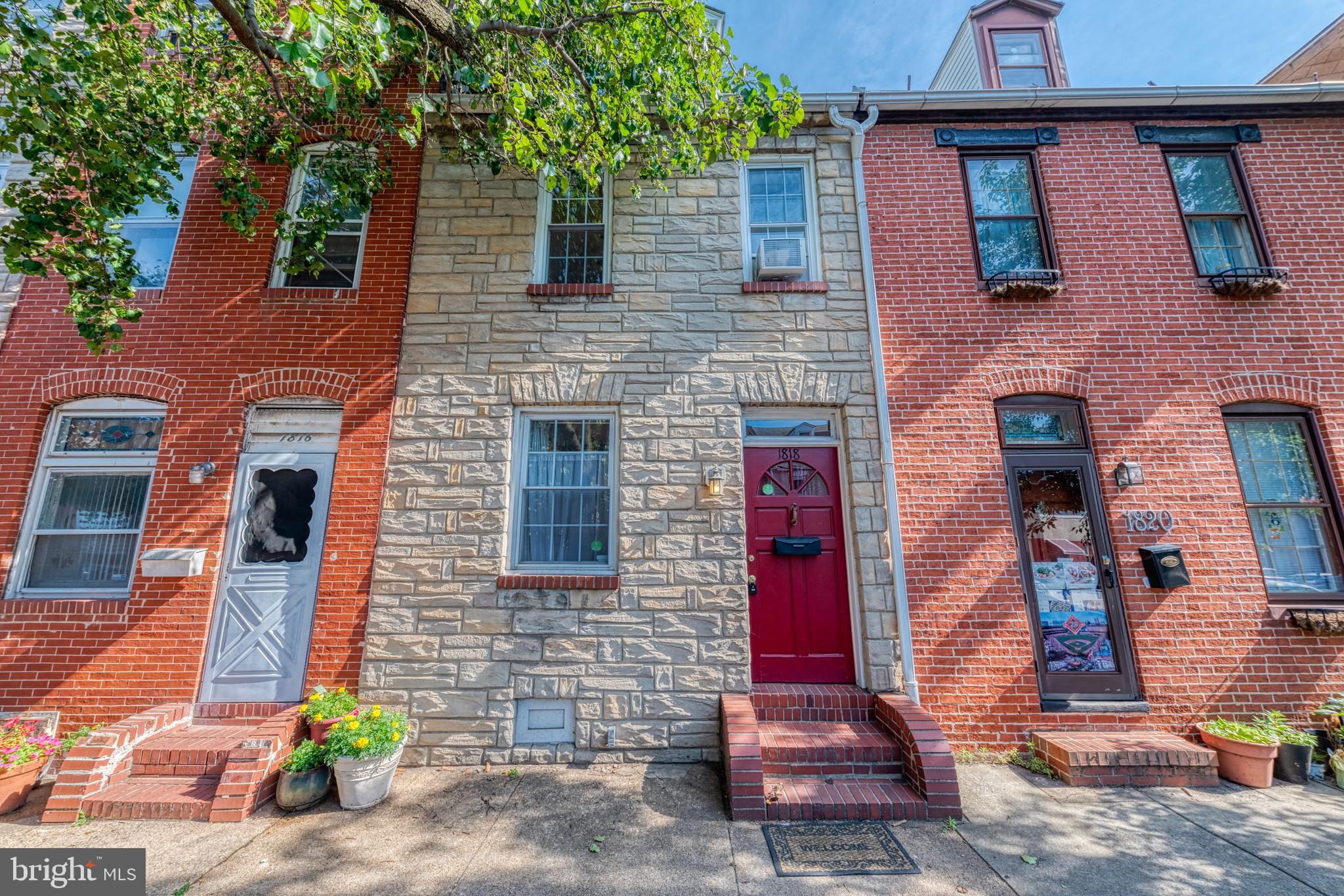 1818 Bank Street Baltimore, MD 21231 - Photo 1 of 20 a front view of a house